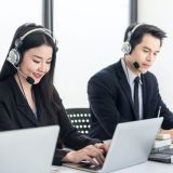 customer-service-woman-and-man-wearing-a-headphone-to-serve-customers-at-the-office-e1702746604470.jpg